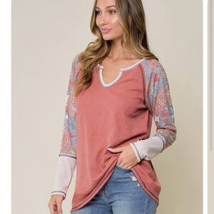 NWT Lovely Melody l/s tunic coral on the body and multi colored fabric on arms.